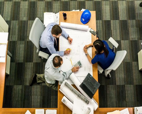 Editorial team collaborating around a table