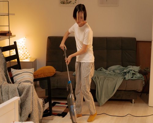 A person cleaning the house comfortably